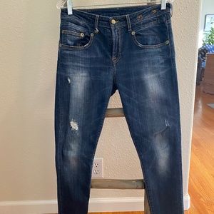 Vintage Blue Skinny Jeans with fading and rips.